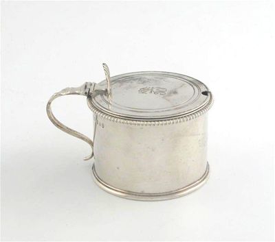 Appraisal: A George III drum mustard pot with a fluted thumb