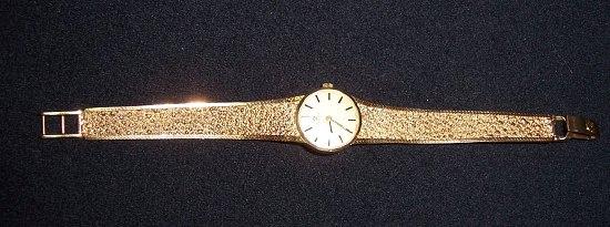 Appraisal: A lady's Omega wristwatch with ct gold articulated strap