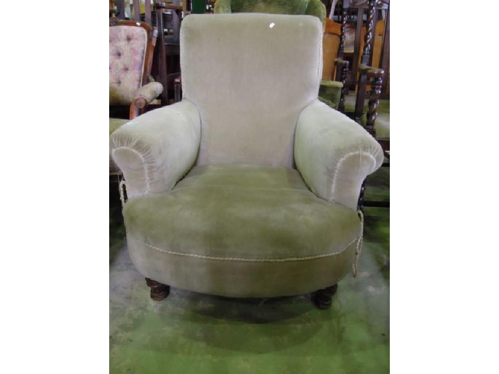 Appraisal: A Victorian easy chair with rolled arms shaped outline upholstered