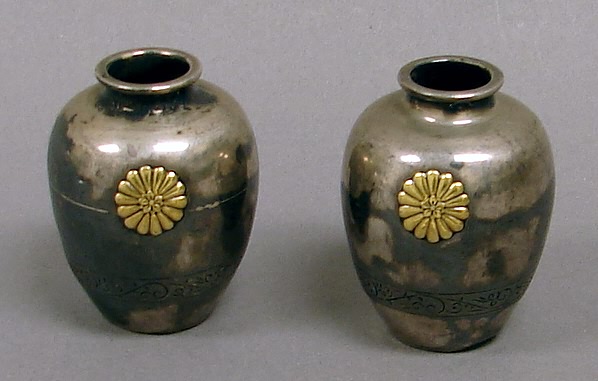 Appraisal: Pair of high silver Japanese vases Each vase presents an