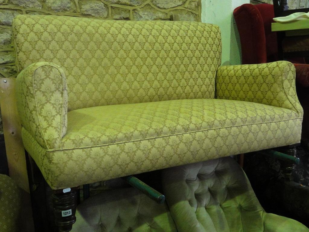 Appraisal: An Edwardian two seat sofa with cream and coffee ground