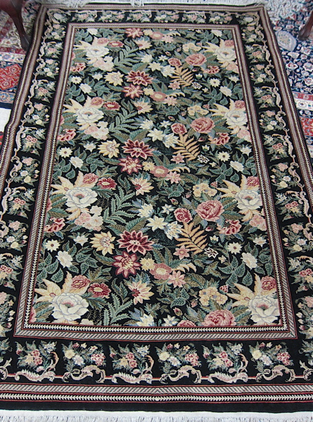 Appraisal: HAND KNOTTED ORIENTAL CARPET Pakistani-Persian overall foliate design on black