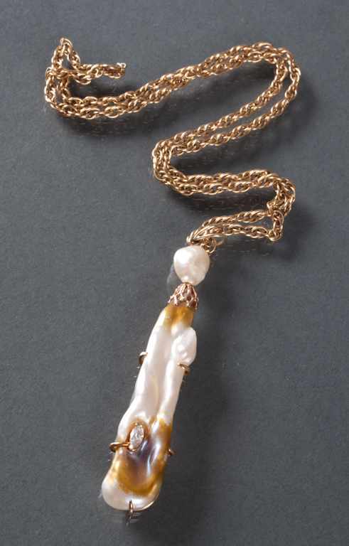 Appraisal: K gold baroque pearl and diamond pendant with a K