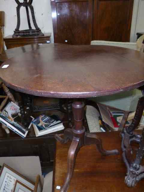 Appraisal: A TH CENTURY MAHOGANY CIRCULAR TILT TOP OCCASIONAL TABLE standing