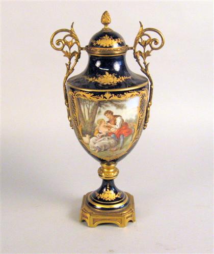 Appraisal: Sevres style gilt metal mounted covered urn Painted with a