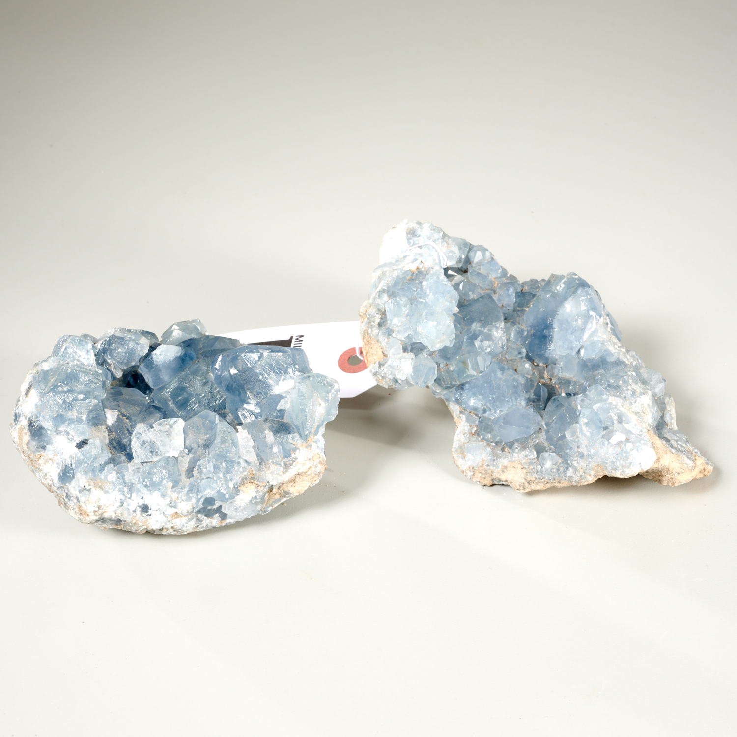 Appraisal: PAIR OF NATURAL BLUE GEODE QUARTZ CRYSTAL CLUSTERS Light blue