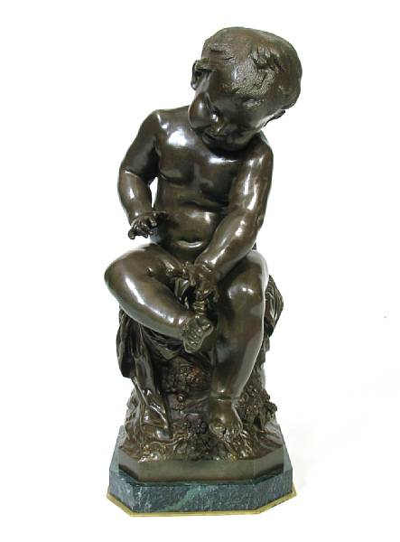 Appraisal: A patinated bronze figure of a boy height in length