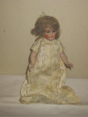 Appraisal: A German all bisque doll with fixed blue glass eyes