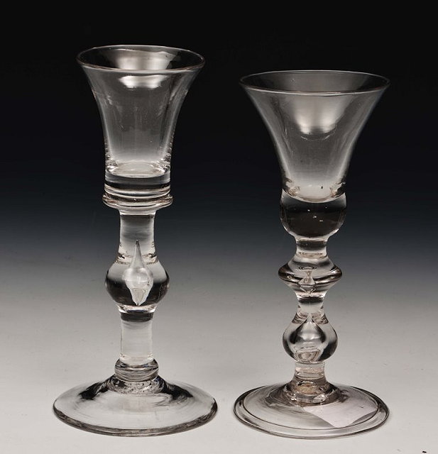 Appraisal: AN ENGLISH BALUSTER WINE GLASS with air-twist stem and another