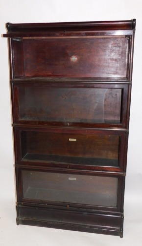 Appraisal: A Globe Wernicke mahogany four section bookcase the pediment over