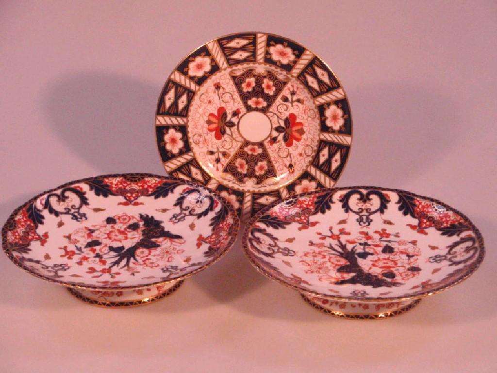 Appraisal: A pair of Royal Crown Derby pedestal comports decorated in