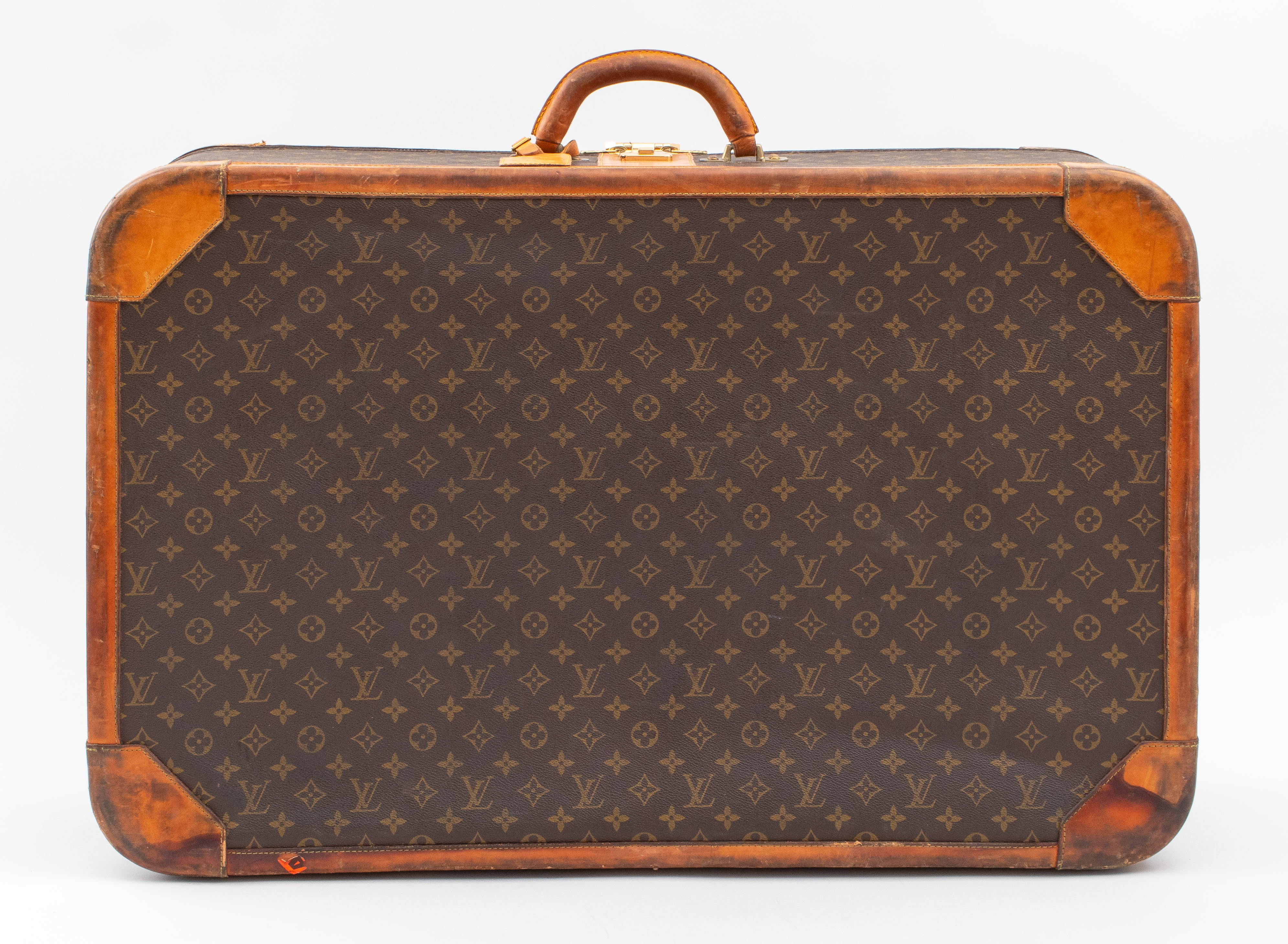 Appraisal: VINTAGE LOUIS VUITTON LEATHER BOUND SUITCASE Vintage Louis Vuitton luggage