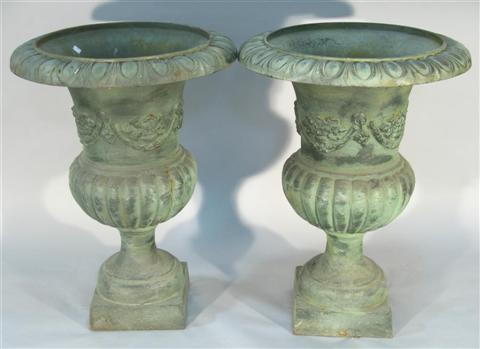 Appraisal: PAIR OF GREEN PATINATED GARDEN URNS After the antique the