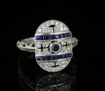 Appraisal: A Ladies' Art Deco Style Ring with Diamonds and Sapphires