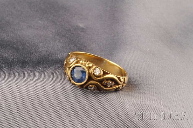 Appraisal: kt Gold Sapphire and Diamond Ring centering a circular-cut sapphire