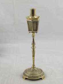 Appraisal: A petrol table cigarette lighter in the form of a