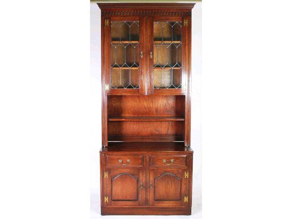 Appraisal: MODERN OAK REPRODUCTION DRESSER the moulded cornice and frieze above