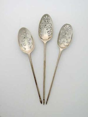 Appraisal: A George II III fancy back mote spoon and two