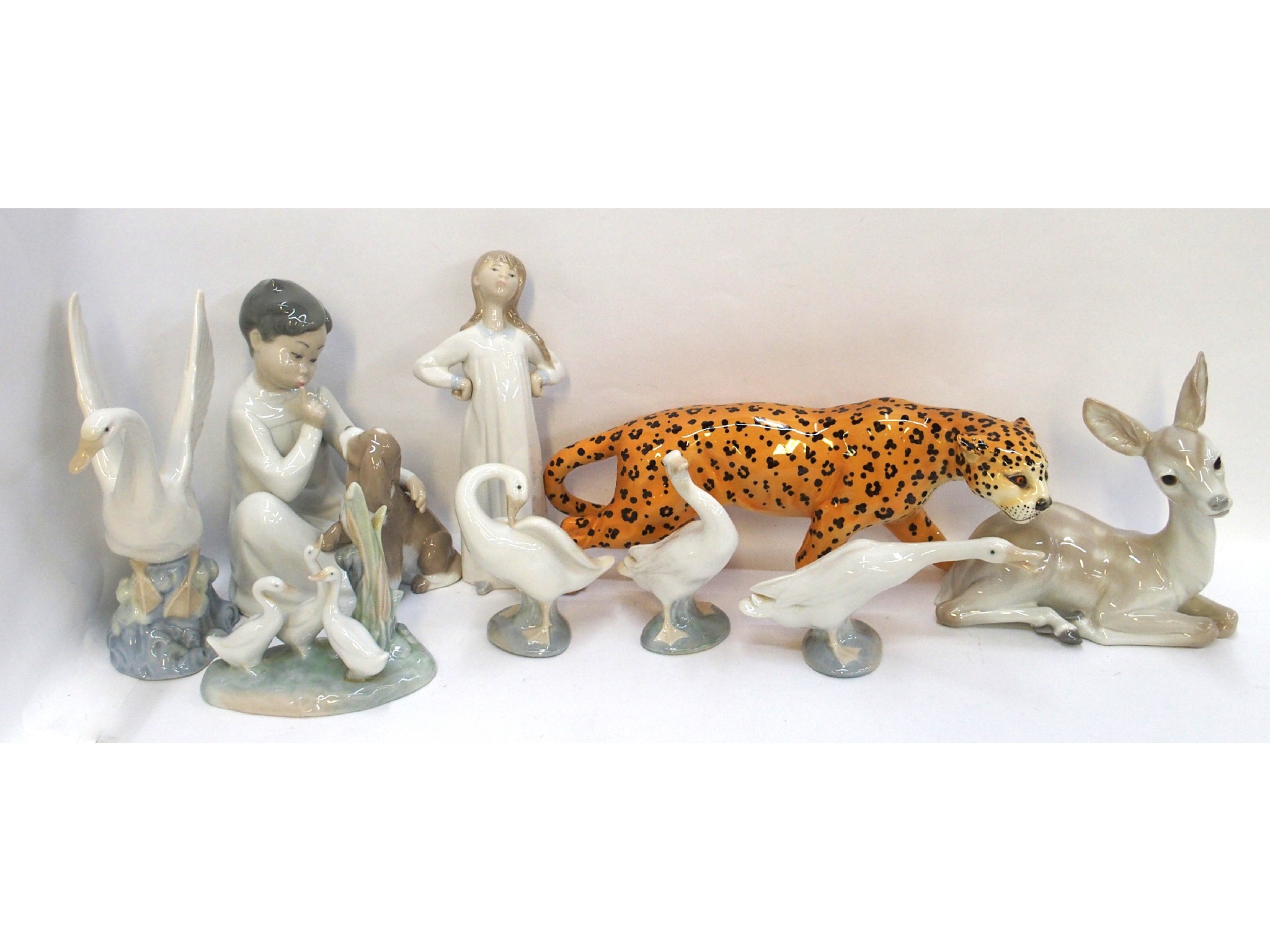 Appraisal: Beswick Leopard and eight assorted Lladro and Nao figures including