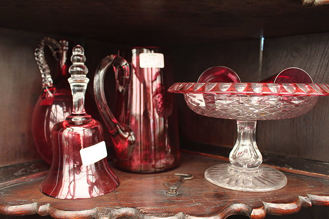 Appraisal: A CRANBERRY GLASS CLARET JUG with faceted stopper cm high