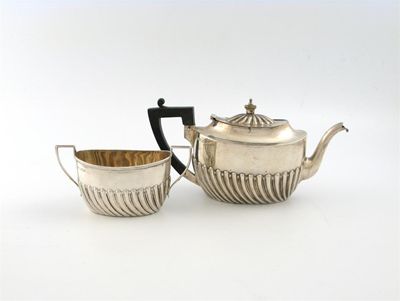 Appraisal: A late Victorian bachelors silver teapot and sugar basin by