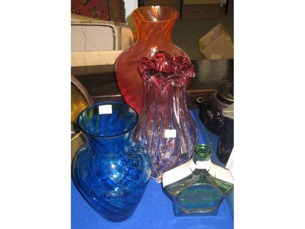 Appraisal: Lot comprising three decorative glass vases and a commemorative bottle