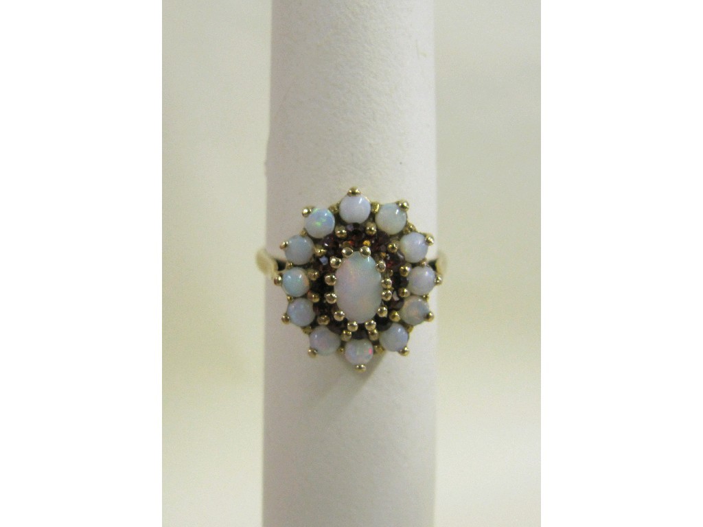 Appraisal: Nine carat gold opal and garnet cluster ring