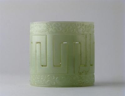 Appraisal: An unusual Chinese green glass articulated cylinder constructed as two