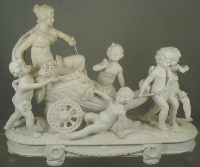 Appraisal: Parian figurine woman in coach surrounded by cherubs some damage