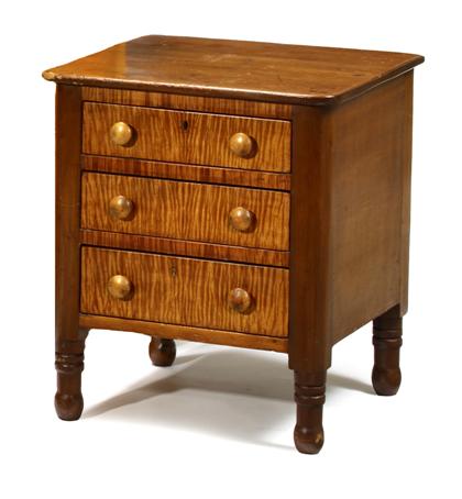 Appraisal: Cherrywood and tiger maple three drawer standfirst quarter th century