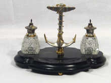 Appraisal: A Dutch silver and ebonised ink stand the central handle