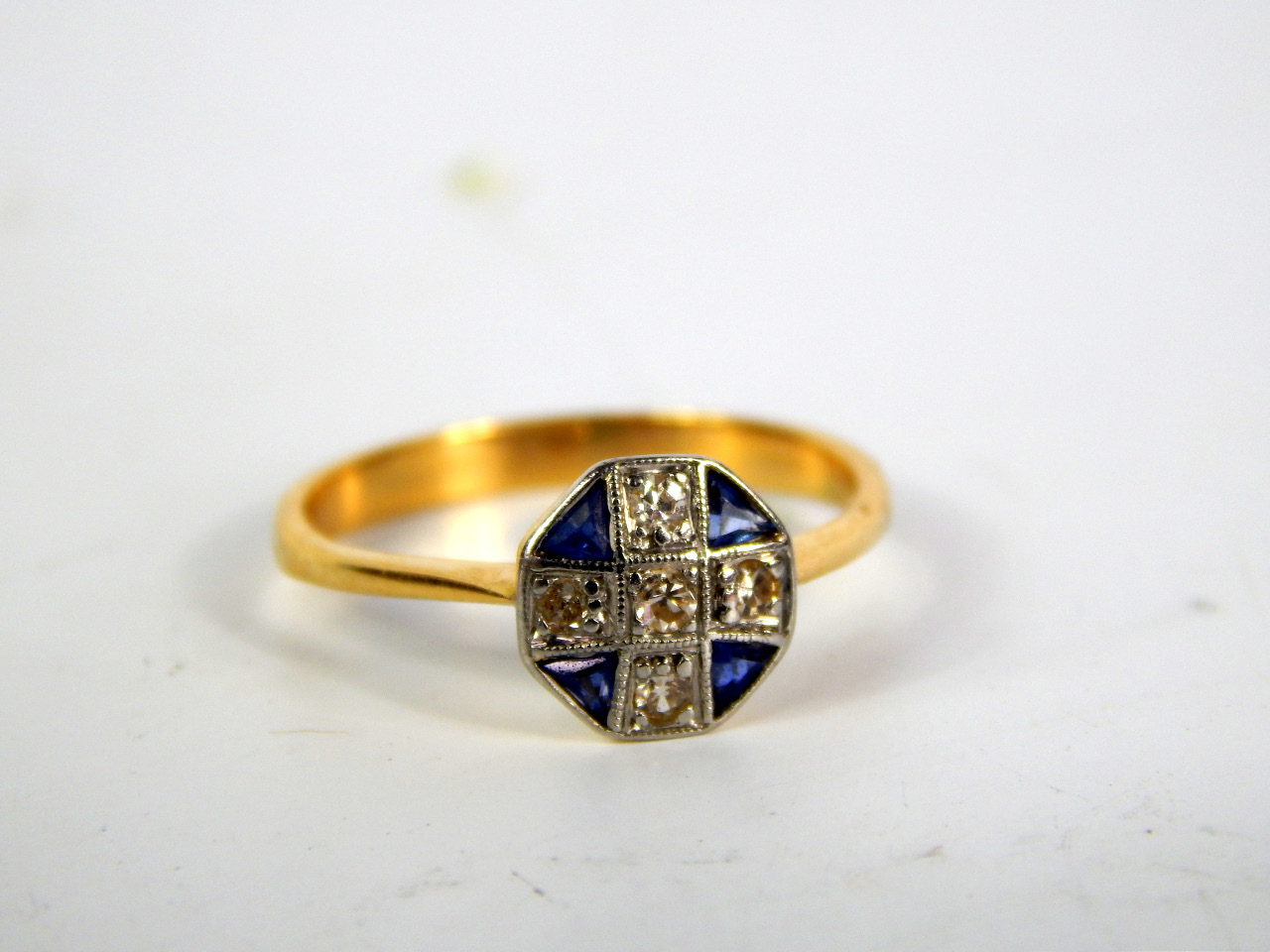 Appraisal: An Art Deco style yellow metal sapphire and diamond ring