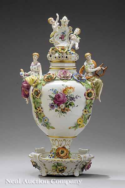 Appraisal: A Dresden Porcelain Figural Lidded Urn on a Conforming Base