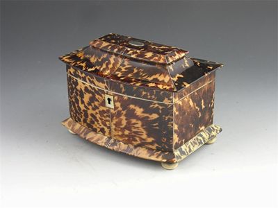 Appraisal: A late Regency bowfront tortoiseshell tea caddy with pewter stringing