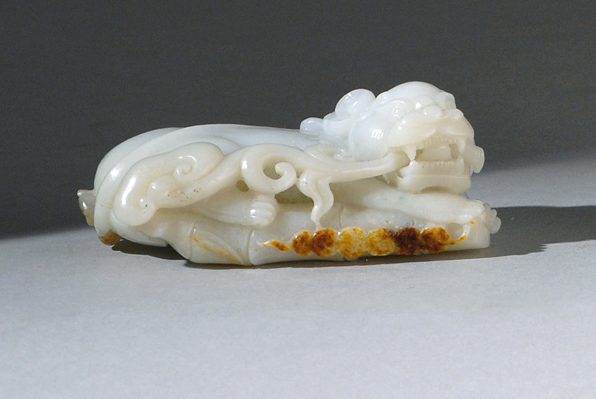 Appraisal: WHITE AND RUSSET JADE CARVING th CenturyIn the form of