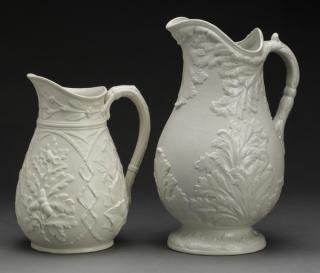 Appraisal: th c English Drabware pitchers Wedgewood Two English relief molded