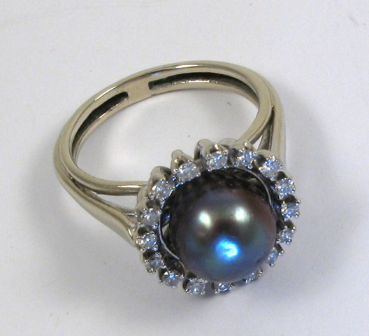 Appraisal: BLACK PEARL AND DIAMOND RING k white gold set with