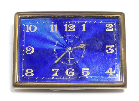 Appraisal: A SMALL TRAVELING CLOCK WITH ALARM ETERNA circa Gilded metal