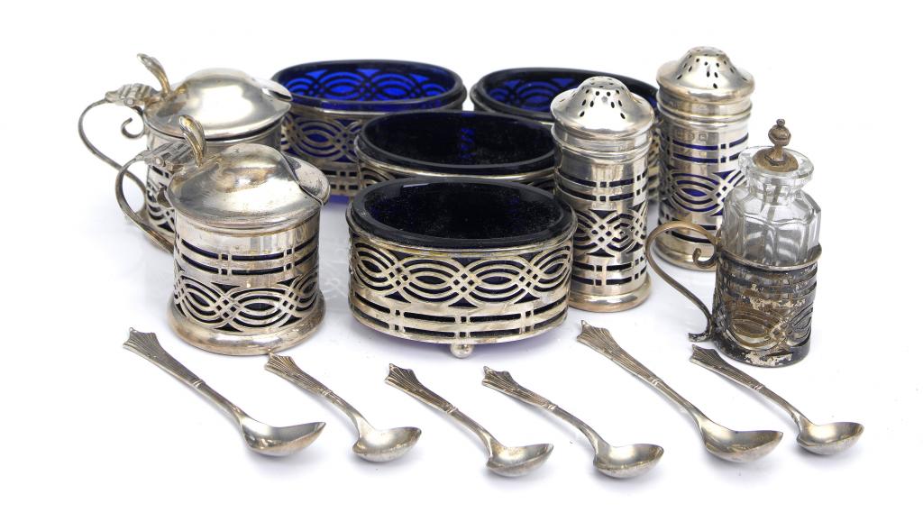 Appraisal: A VICTORIAN NINE-PIECE CONDIMENT SET of pierced cylindrical shape with