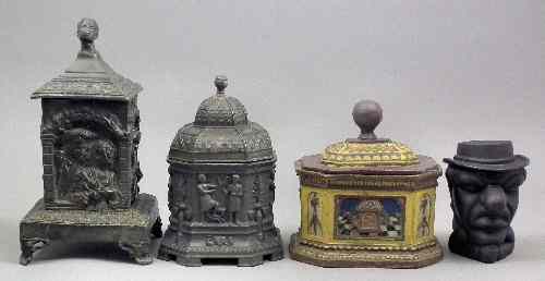 Appraisal: A cast lead square tobacco jar and cover cast with