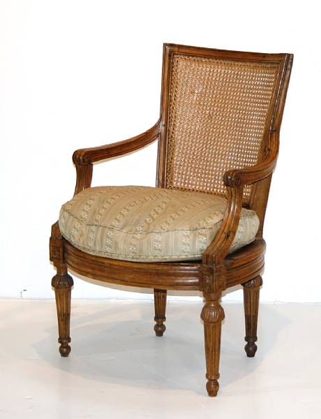 Appraisal: A Louis XVI walnut fauteuil en cabriolet