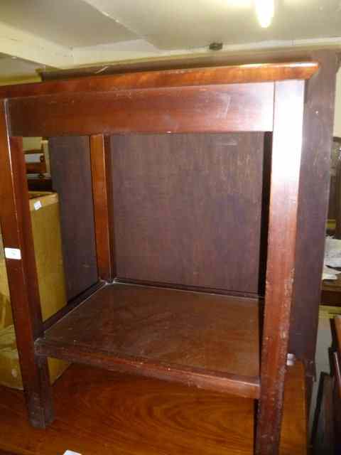 Appraisal: A MAHOGANY TWO TIER OCCASIONAL TABLE of square cut form