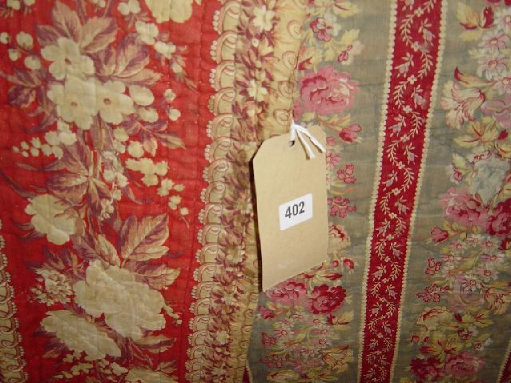 Appraisal: A th century quilted bed cover with pink cream and