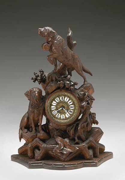 Appraisal: A Black Forest lindenwood mantel clock late th early th