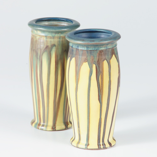 Appraisal: Pair of unusual PETERS AND REED vases in bright yellow