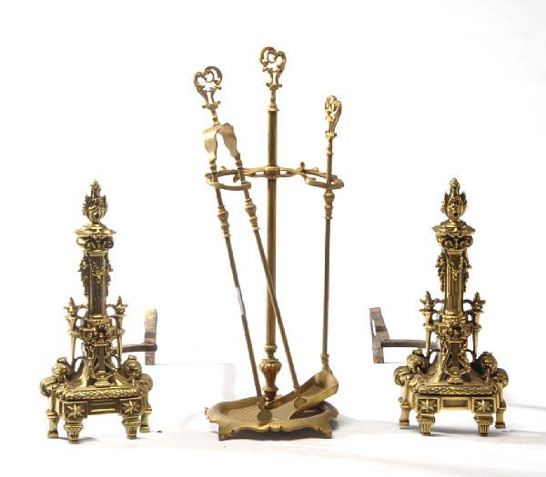 Appraisal: A pair of Louis XVI style brass chenets and three