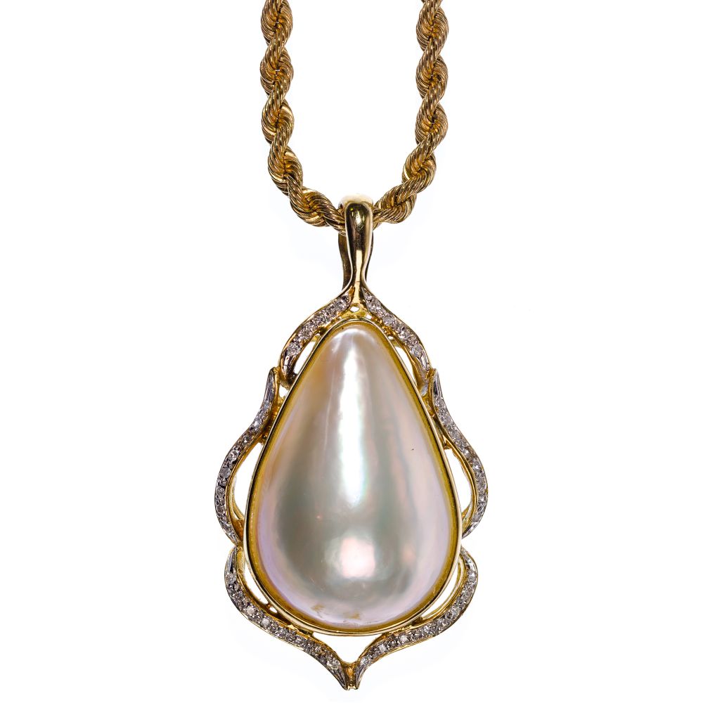 Appraisal: K YELLOW GOLD AND MABE PEARL PENDANT ON TWISTED ROPE