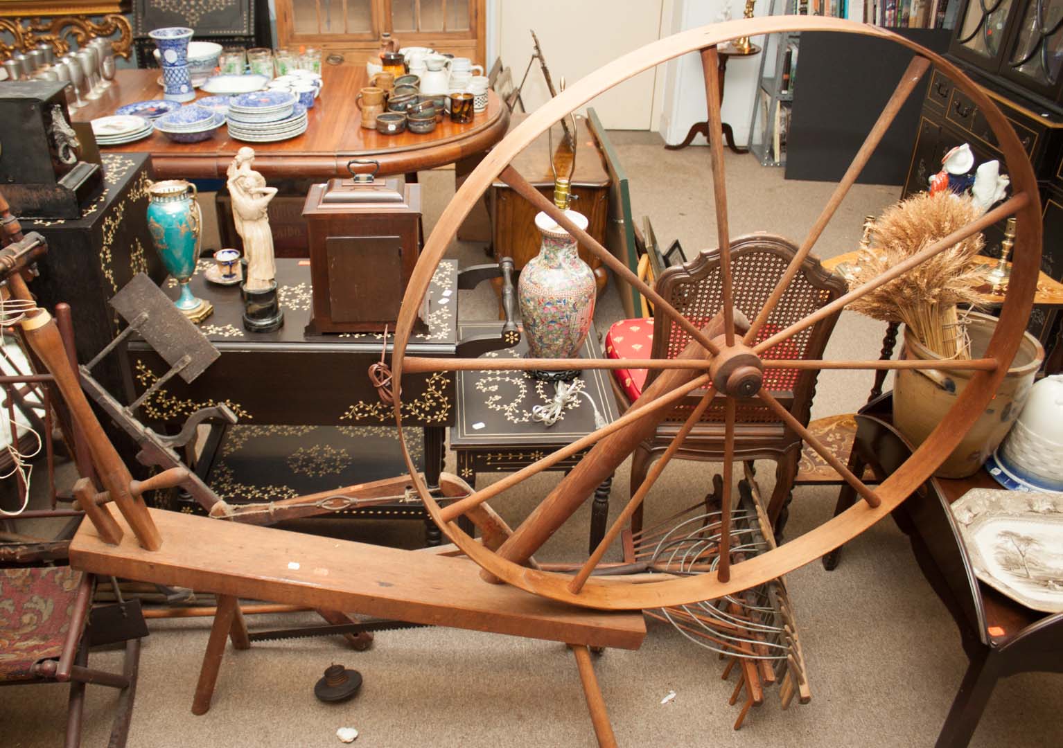 Appraisal: Vintage tools including spinning wheel hand saw and four wood