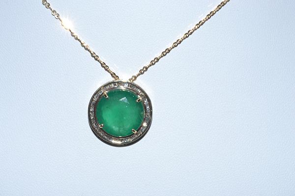 Appraisal: AN EMERALD AND DIAMOND PENDANT EMERALD WEIGHING APPOXIMATELY CTS TO