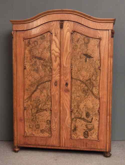 Appraisal: A th Century Continental ash armoire with arched and moulded